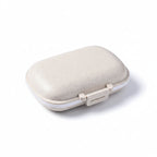 boîte à pilule de couleur beige sur fond blanc