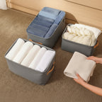 3 boîtes de rangement grises pour vêtements  