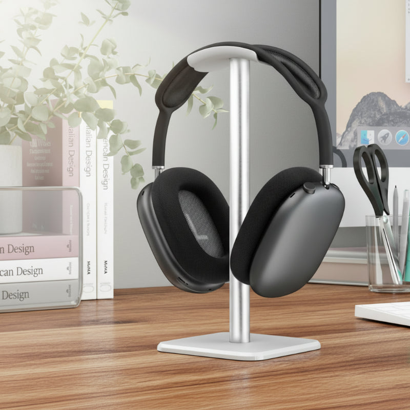 casque noir sur support casque audio blanc