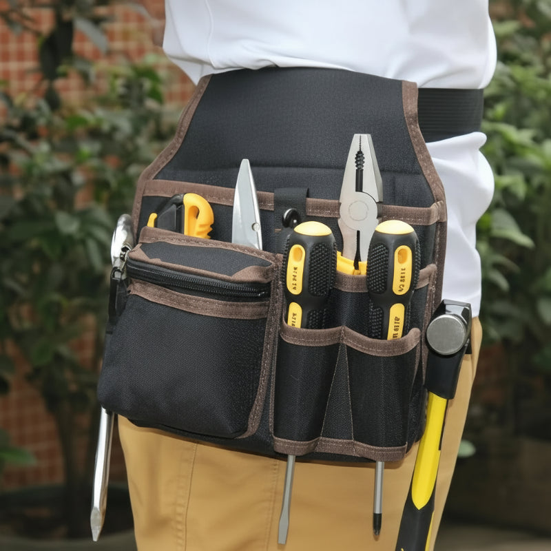 ceinture de rangement pour outils de couleur marron fixé sur un pantalon d'ouvrier