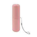 organisateur de brosse à dents de voyage de couleur rose sur fond blanc