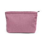 organisateur cosmétique pour voyage de couleur rose sur fond blanc