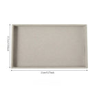 plateau pour bijoux en velours de couleur gris et vide