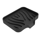 porte savon de couleur noir sur fond blanc