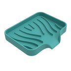 porte savon de couleur vert sur fond blanc