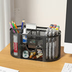 le rangement fourniture scolaire noir remplit et posé sur le bureau