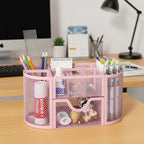 le rangement fourniture scolaire rose remplit et posé sur le bureau