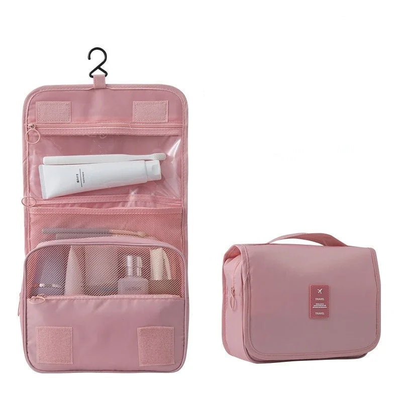 la trousse de maquillage pour voyage de couleur rose